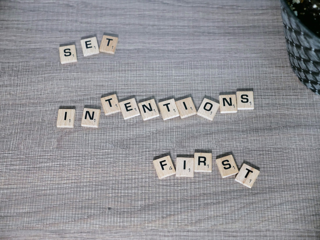 scrabble tiles spelling out the words set in intentions first