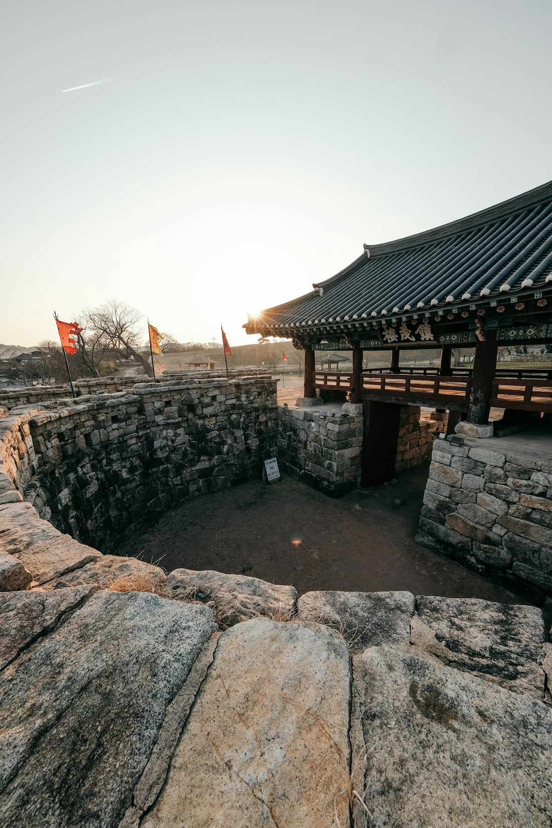A traditional korean gate at sunset