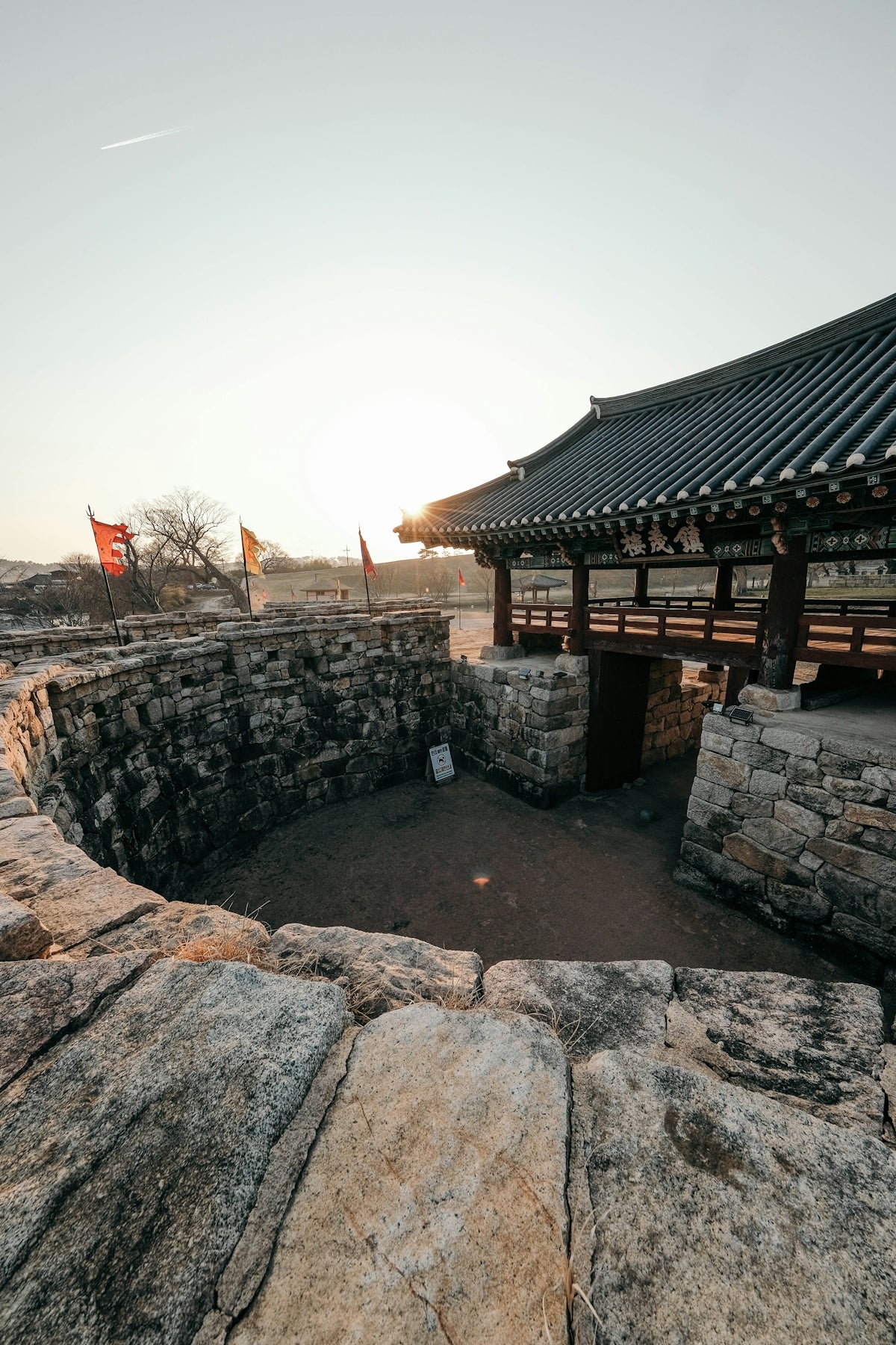 A traditional korean gate at sunset