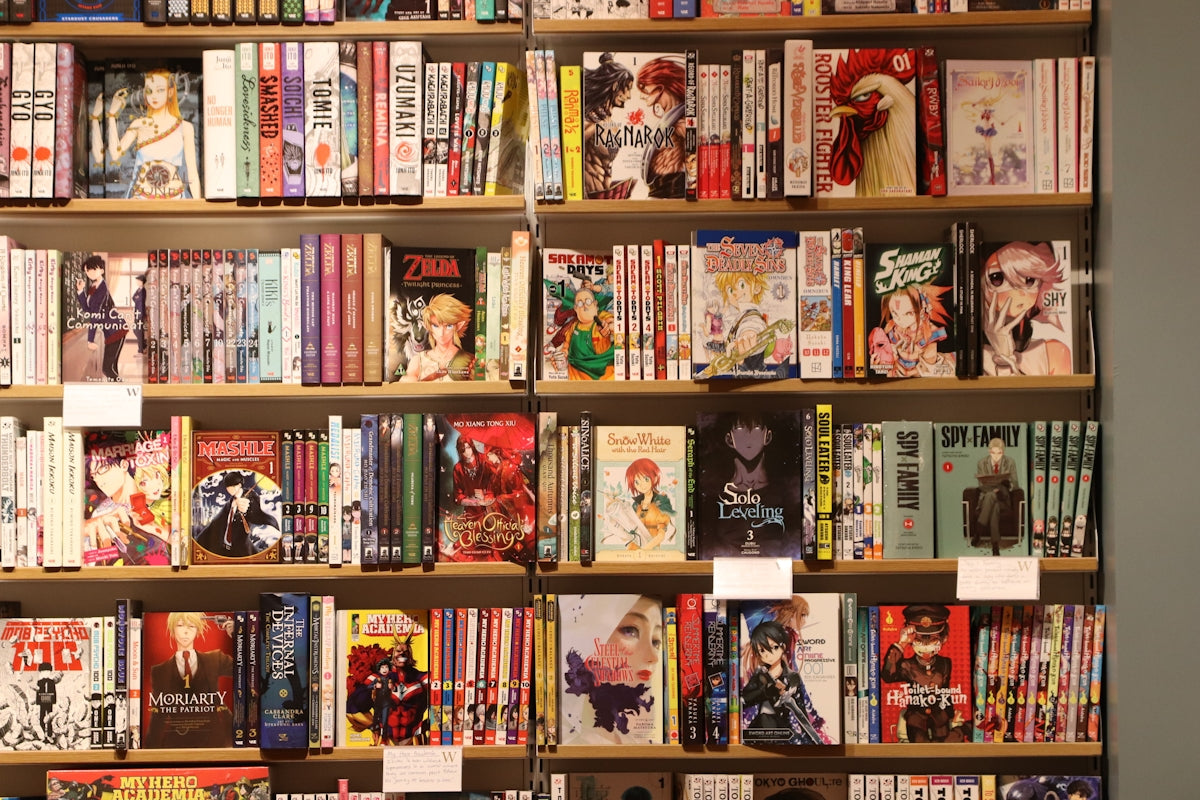 Bookshelves are filled with various manga and books